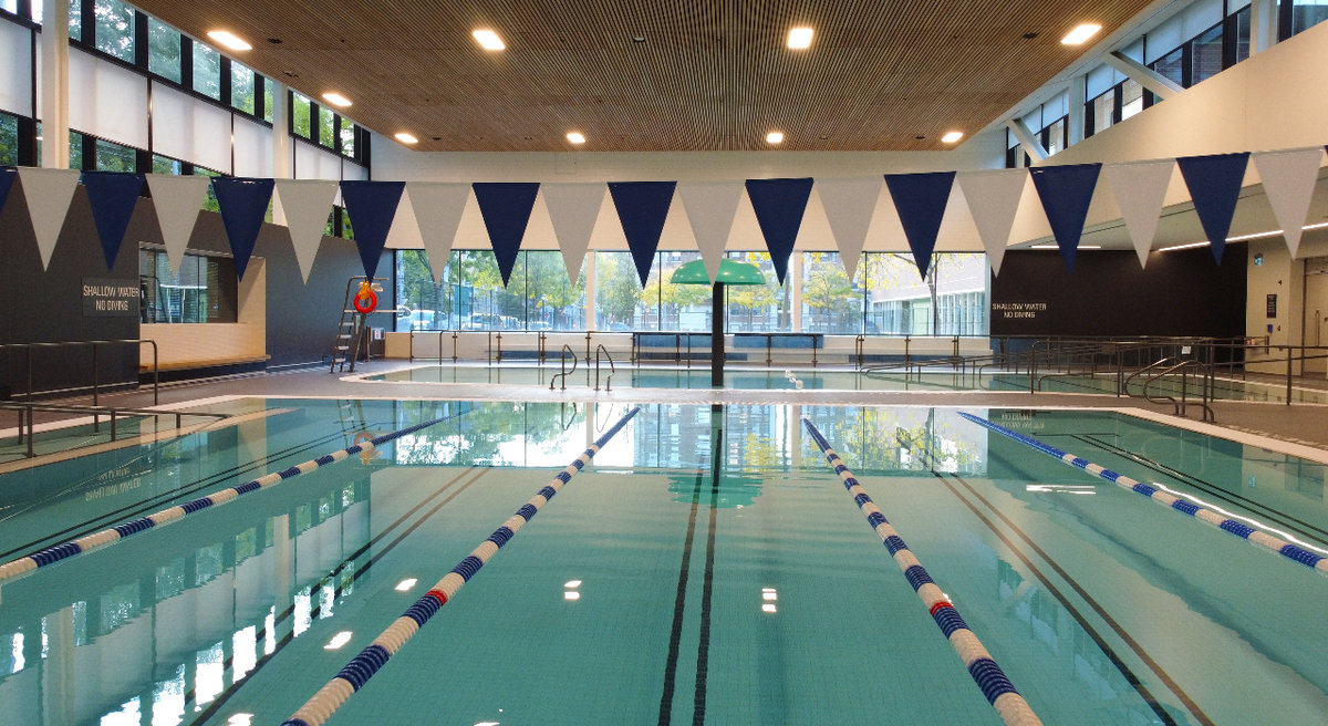 Wellesley Community Centre's indoor lap pool and leisure pool with a water umbrella